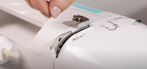 Thread a sewing machine