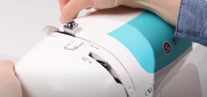 Thread a singer sewing machine