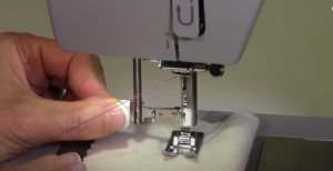 How to use an automatic needle threader